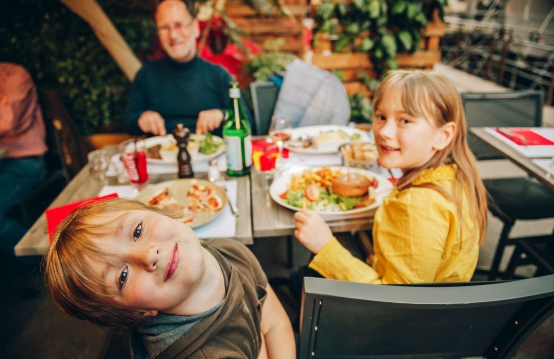 A family with young children at a restaurant.