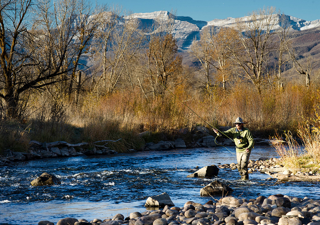 Man fly fishing for trout in Park City, Utah.