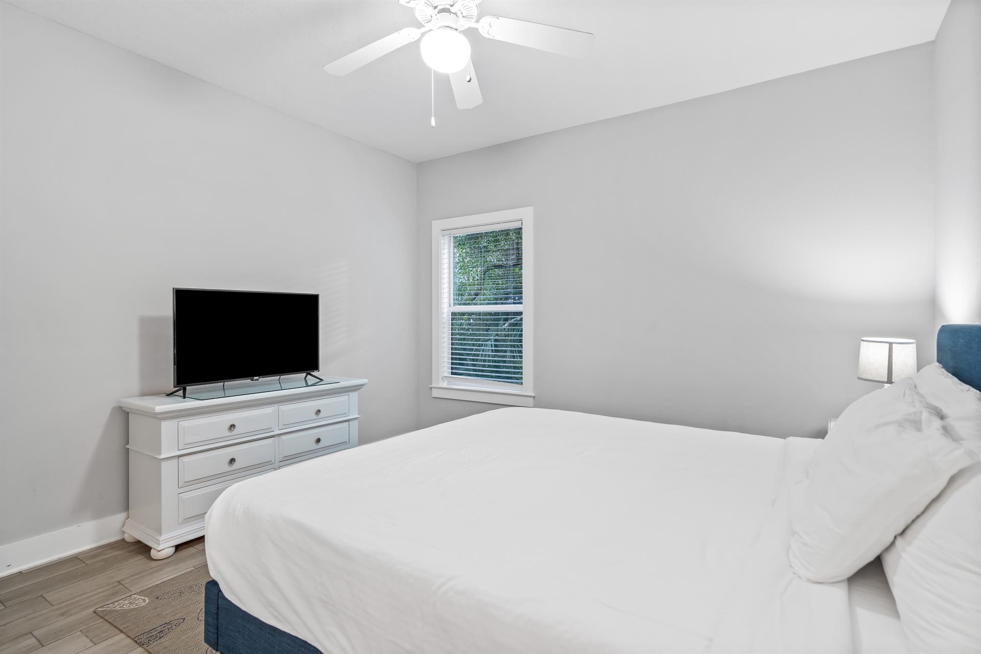 Another view of 1st floor bedroom with a king bed, 42 Smart TV and ensuite bathroom.
