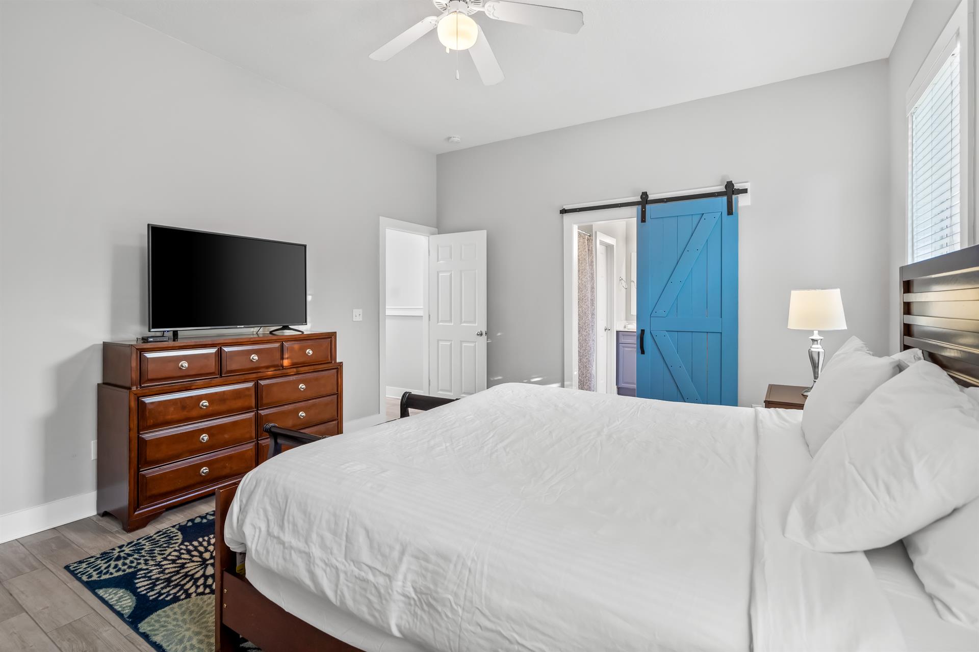 Second floor primary bedroom with ensuite bathroom  50 Smart TV with cable.