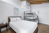 Queen bed with triple bunk, queen on the bottom,a full in the middle and twin on top with en suite bath. Bedroom 4