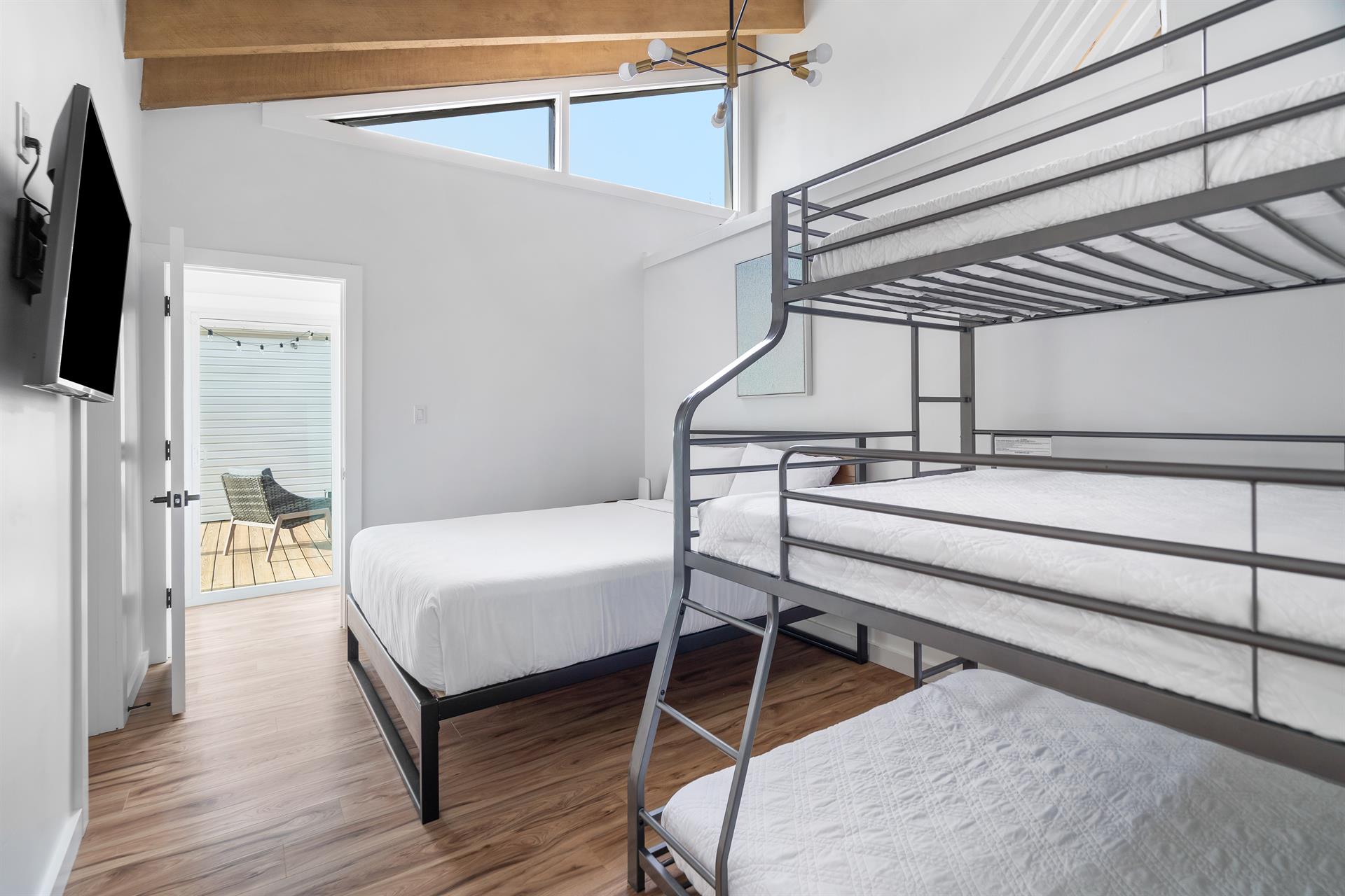 Queen bed with triple bunk, queen on the bottom,a full in the middle and twin on top with en suite bathroomshower. Bedroom 4