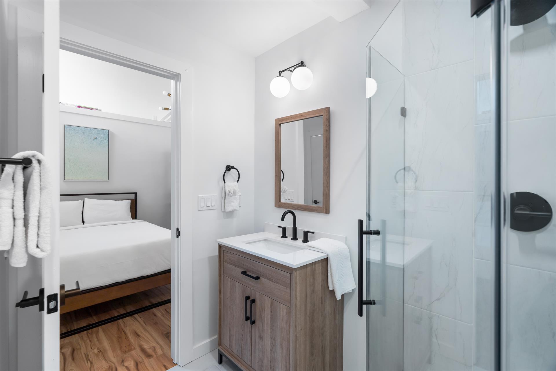 Queen bed with triple bunk, queen on the bottom,a full in the middle and twin on top with en suite bathroomshower