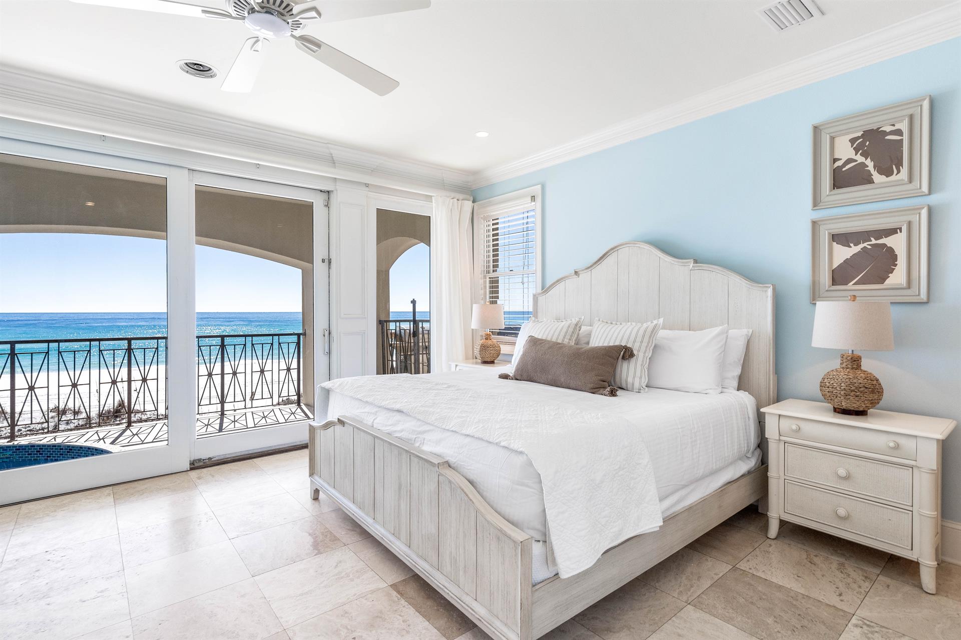 First floor bedroom with king bed, ensuite bathroom and wet bar overlooking the splash pool and Gulf.