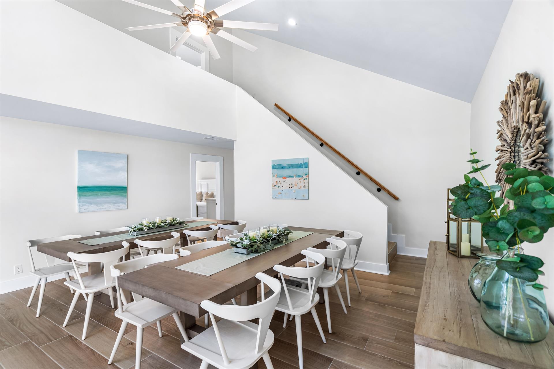 Dining Tables for 16 people Plus the 4 Seats in the Kitchen. Stairs leading up to 2 More Bedrooms