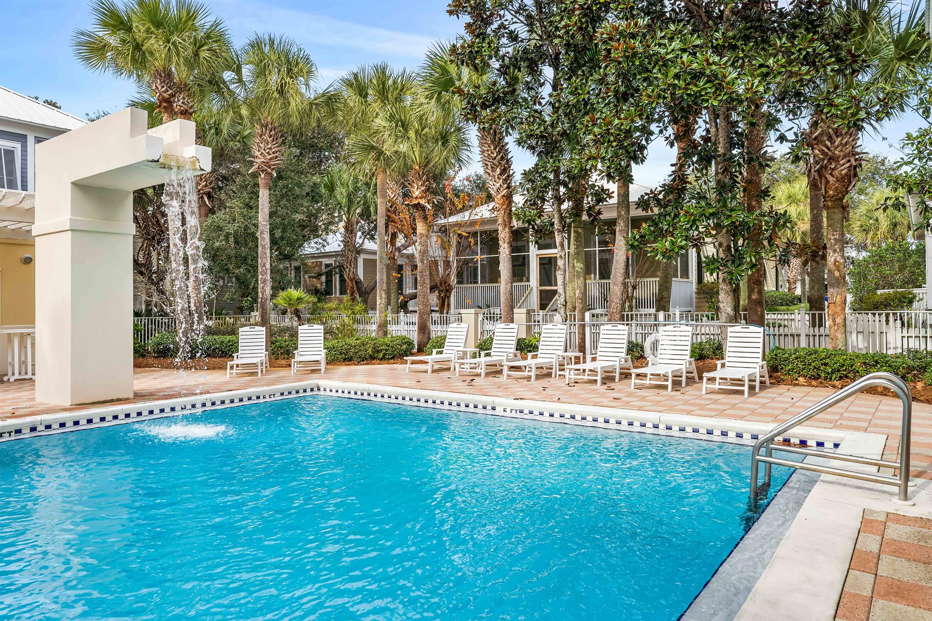 The Frangista Beach Community Pool less than a minute walk from Southern Comfort. Gated entrance, waterfall feature, chaise lounge chairs  dressing rooms.