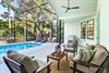 Covered and Enclosed Pool Deck with Outdoor Living Space