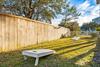 Fenced in side yard Corn Hole