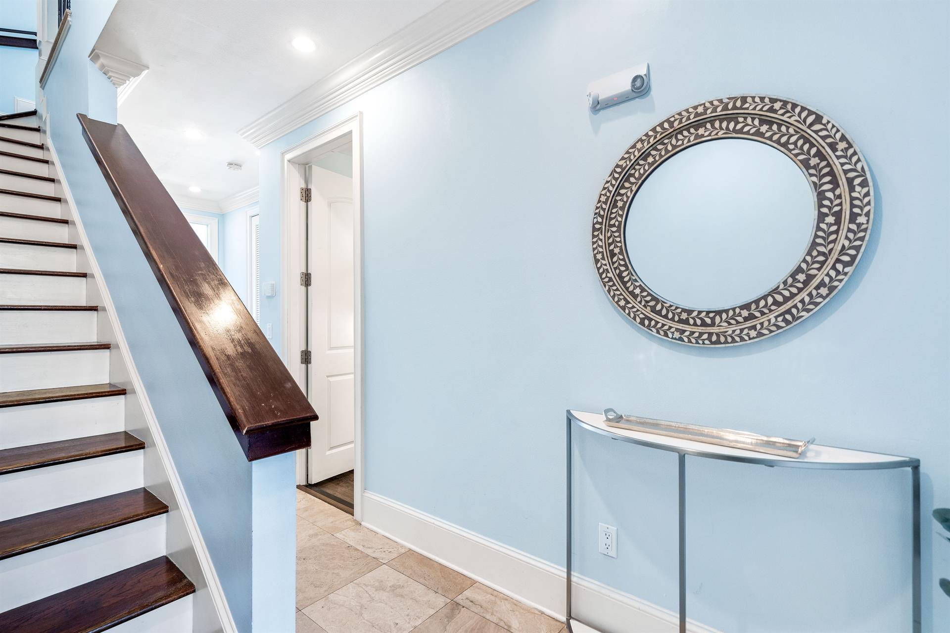 First Floor Level Leads to the King Bedroom and 4 Queen Bed Bunkroom. Stairs lead to the Second Floor Main Living and Kitchen Area.