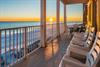 Order up 1 fabulous sunset with your rocking chairs plus outdoor dining table on this 2nd floor balcony