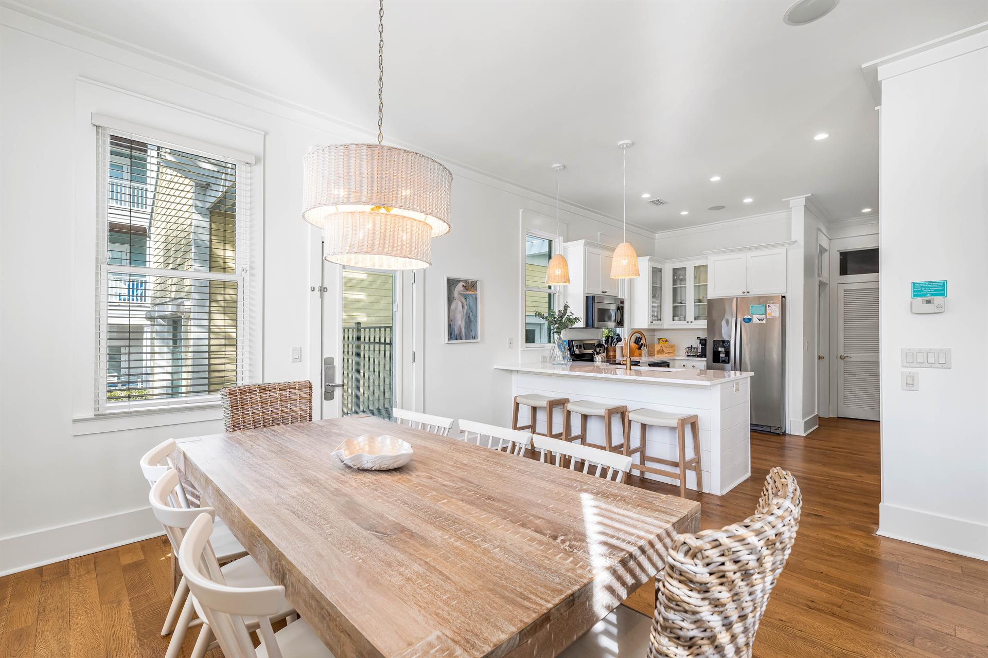 Plenty of Dining Space  Table for 8 with 3 seats at the bar.