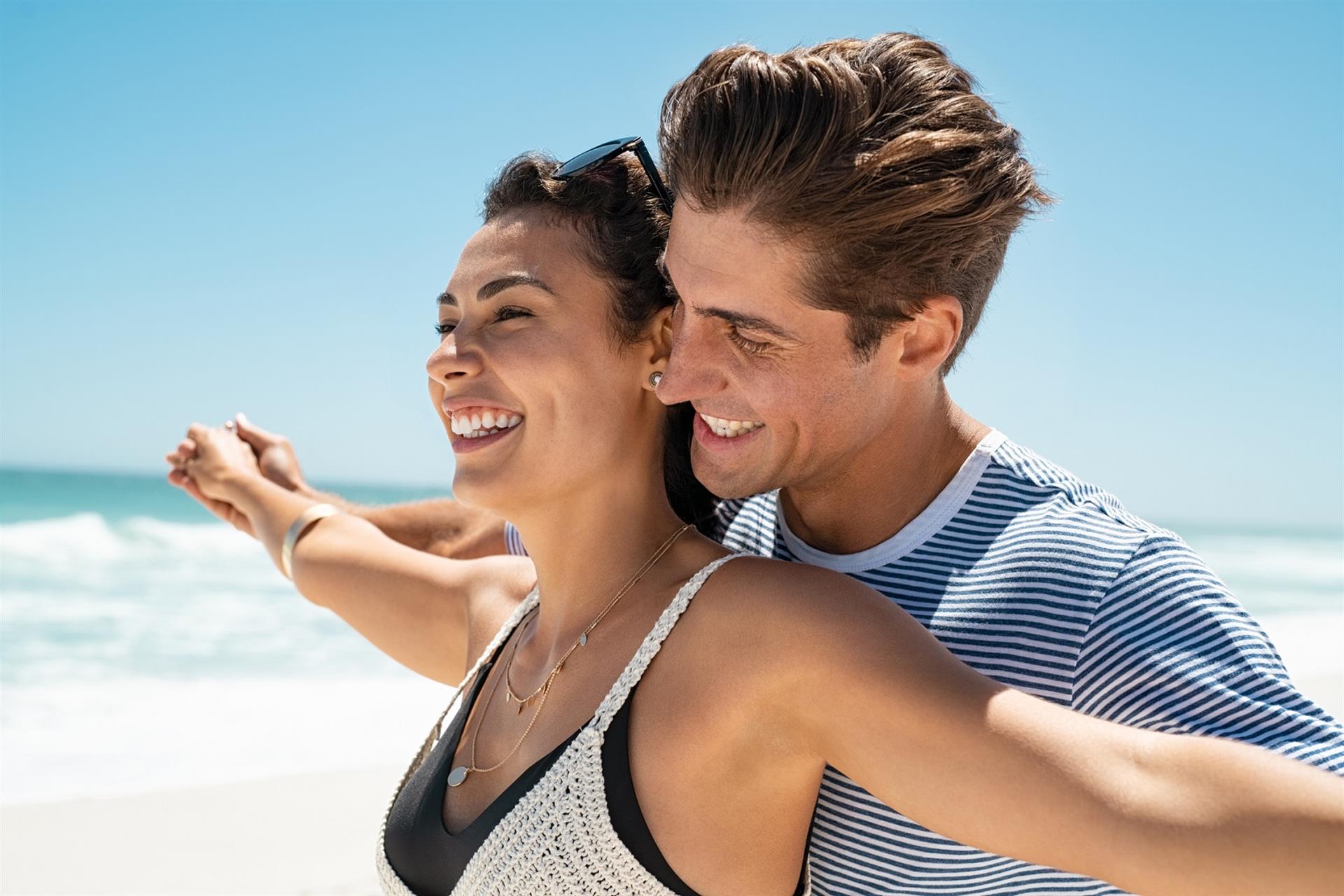 Couple on beach during fall