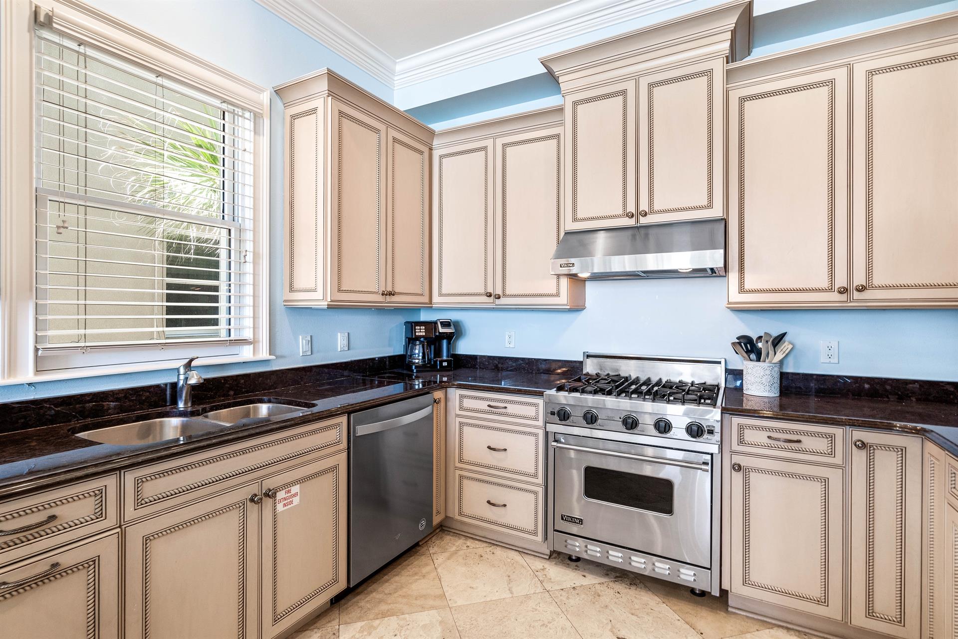 Amazing Kitchen with a Viking Gas Range, Stainless Steel Appliances, Granite Countertops and Custom Cabinetry.  Separate Ice Maker for Filling Up your Cooler