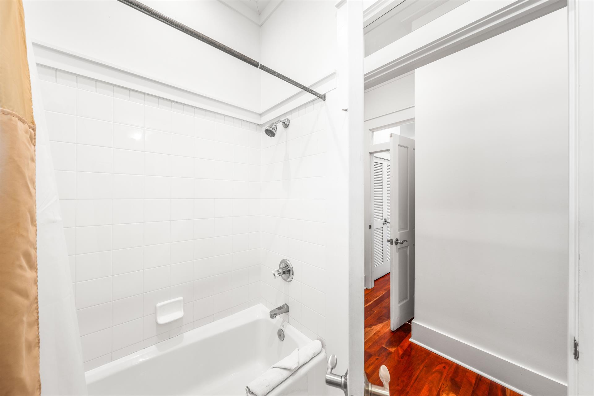 Ensuite bathroom for 3rd floor northeast queen  bedroom.  Marble vanity and bathtubshower combination.