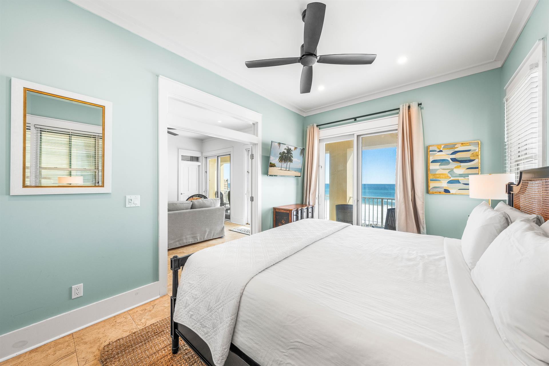 This king  bedroom is just off the cabana room on the first floor with a balcony and wet bar and coffee setup.