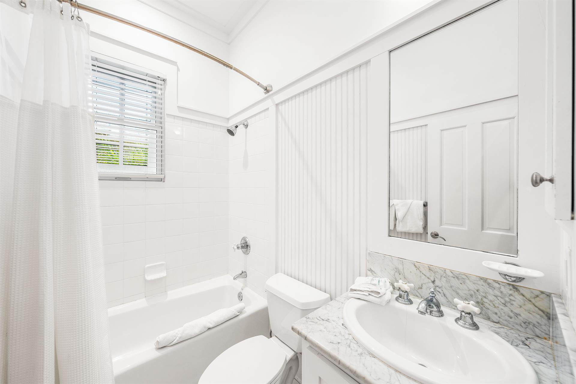 Ensuite bathroom for 3rd floor northwest queen  bedroom.  Marble vanity and bathtubshower combination.