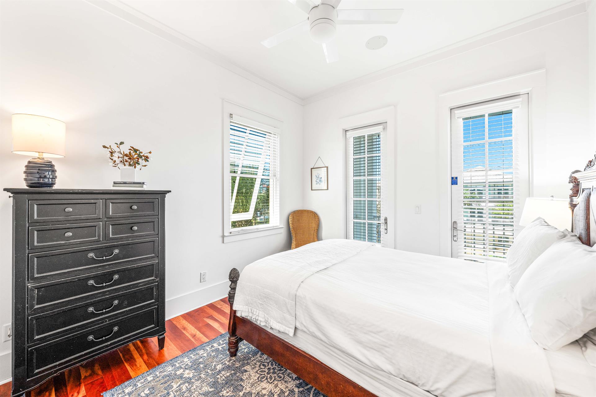 3rd floor northwest bedroom with queen bed, tv   ensuite bathroom  Balcony overlooking the Frangista Beach community.