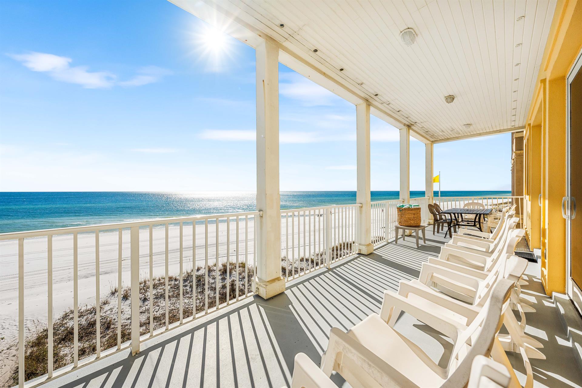 Rocking chairs plus an outdoor dining table on this 2nd floor balcony