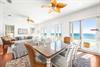 Dine with a view or lounge with a breeze in the 2nd 
 floor great room with balcony.   Space for everyone in this livingdining area, chefs kitchen, 50 tv,  expansive views of the Gulf, covered balcony the width of the home on all 3 levels