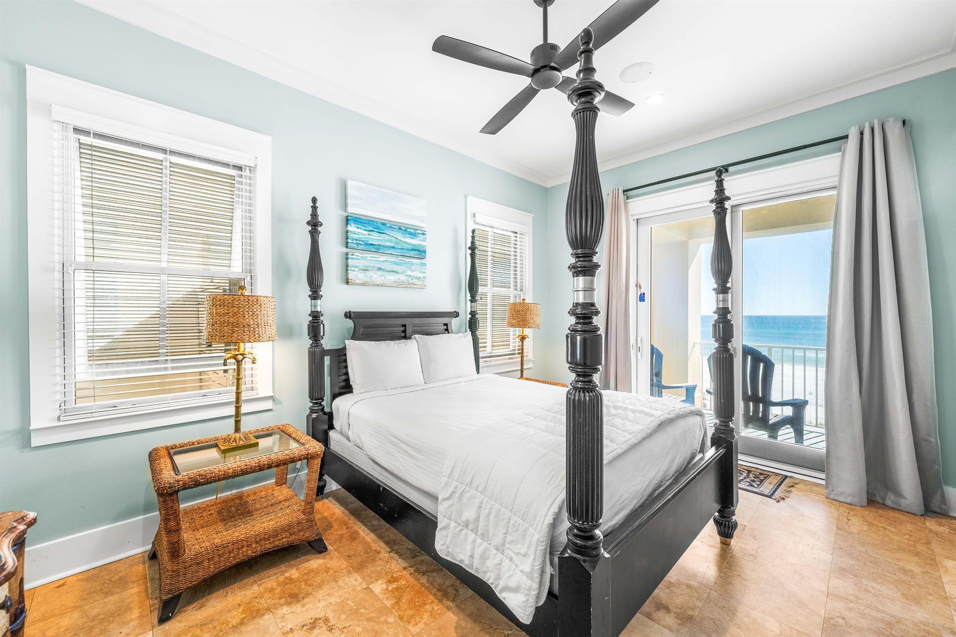 1st floor bedroom with queen bed, 50 smart tv, ensuite bathroom, and Gulf view.