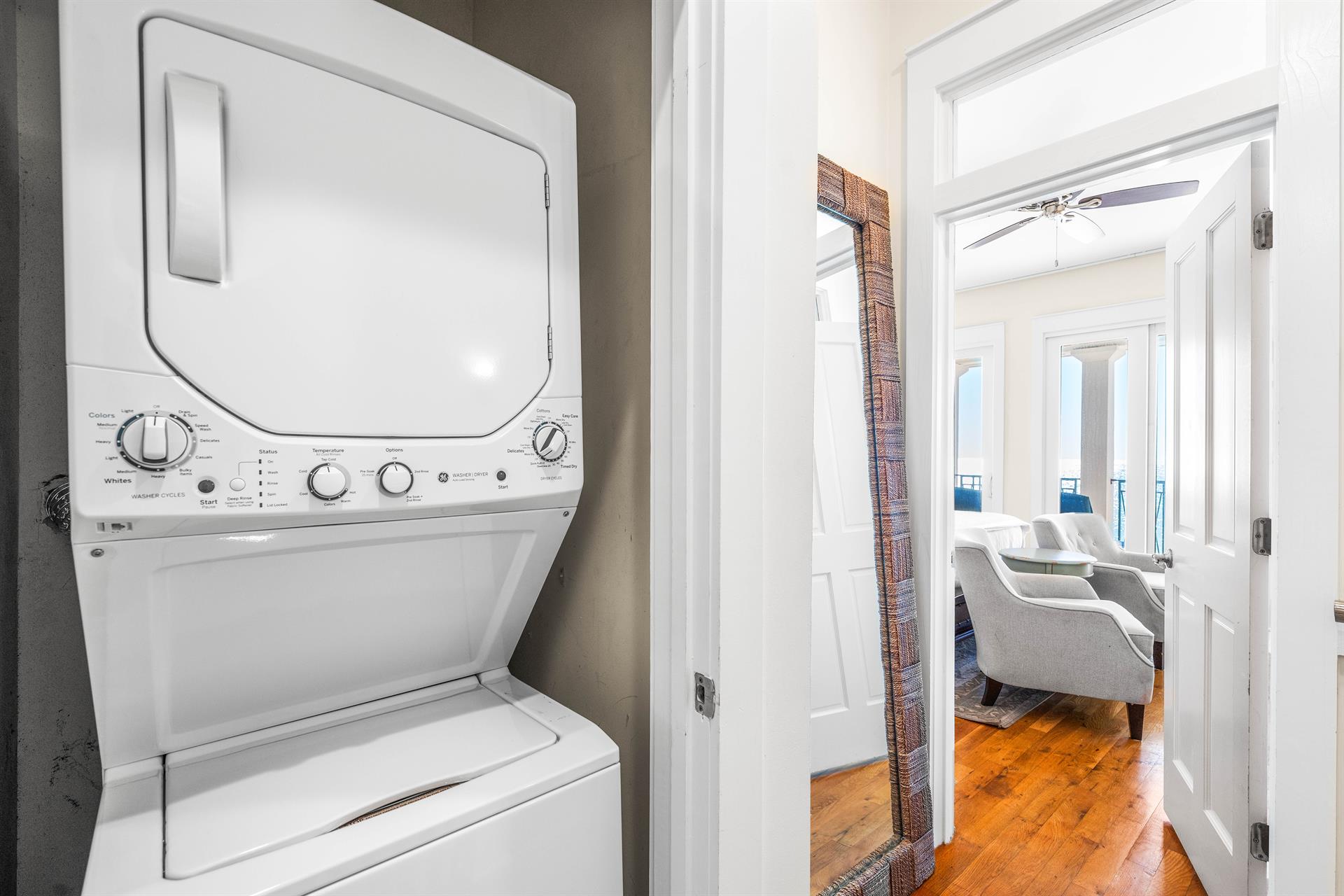 Washer  dryer in hall outside the primary bedroom with detergent  dryer sheets for your stay
