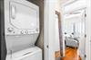 Washer  dryer in hall outside the primary bedroom with detergent  dryer sheets for your stay