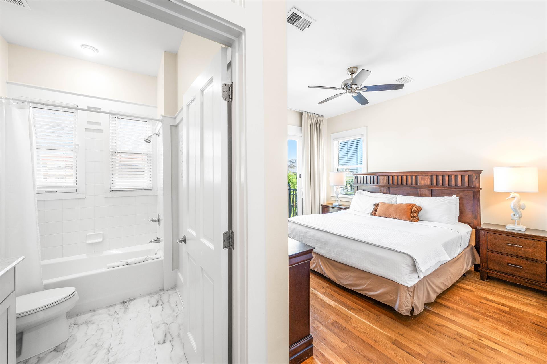 Third Floor Guest Bedroom with King Bed, Ensuite Bathroom  Balcony Overlooking the Frangista Beach Neighborhood.