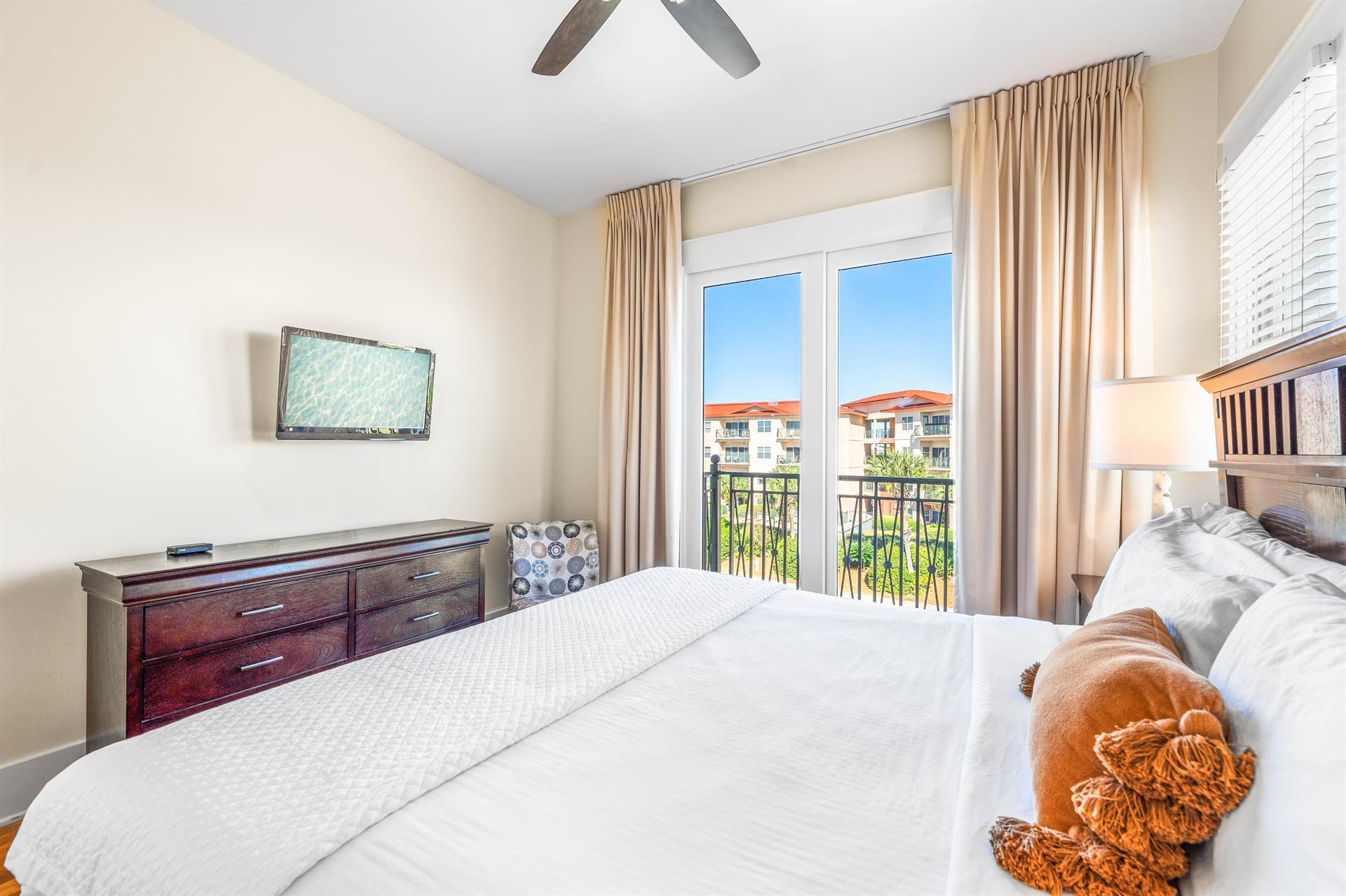 Third Floor Guest Bedroom with King Bed, Ensuite Bathroom  Balcony Overlooking the Frangista Beach Neighborhood.