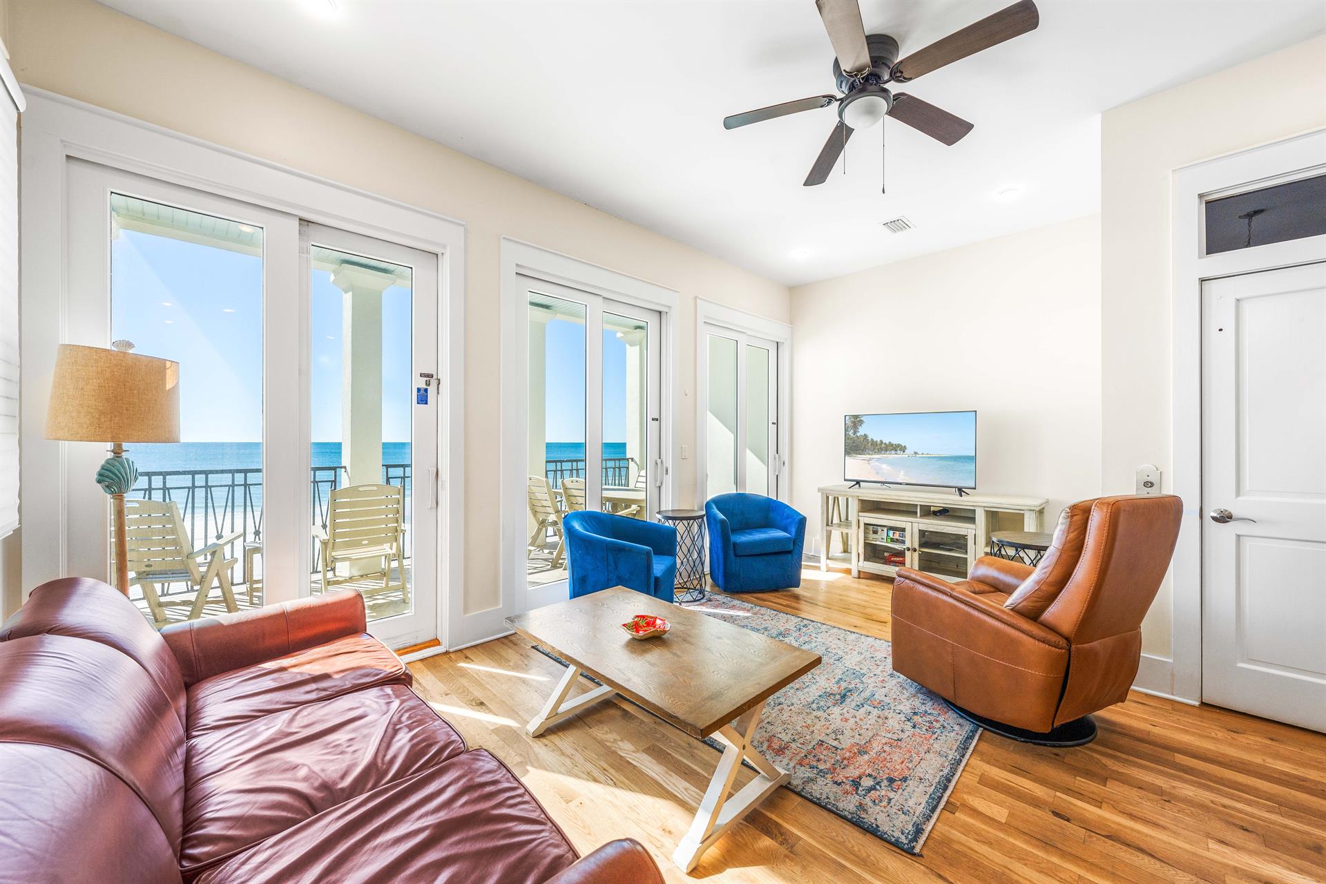 2nd Floor Living area with open floor plan, queen sleeper sofa, 50 Smart TV, Gulf Views  Covered balcony with outdoor dining table.