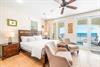 1st Floor Bedroom with King Bed, 48 TV, Ensuite Bathroom  Beachfront Balcony with Splash Pool.  Elevator Access to the Upper Floors