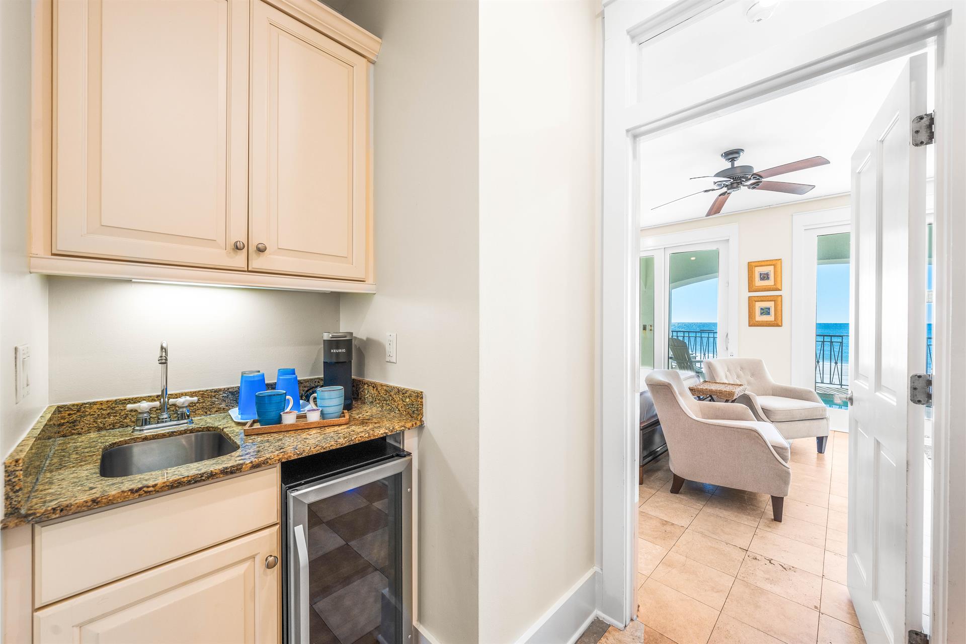 First Floor Wet Bar with Beverage Cooler  Keurig Coffee SetUp Just Outside the Beachfront Guest King Bedroom Suite.