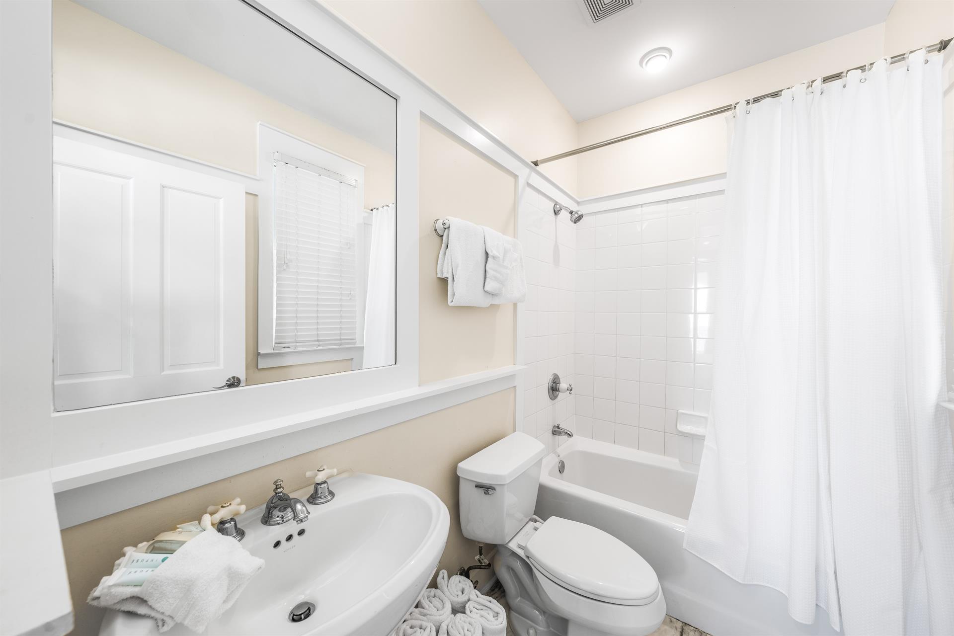 1st Floor Ensuite Bathroom for the Guest King Bedroom.  Bathtub with Shower.