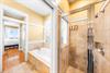 Full Bathroom with Double Vanity, Soaking Tub and Walk In Shower