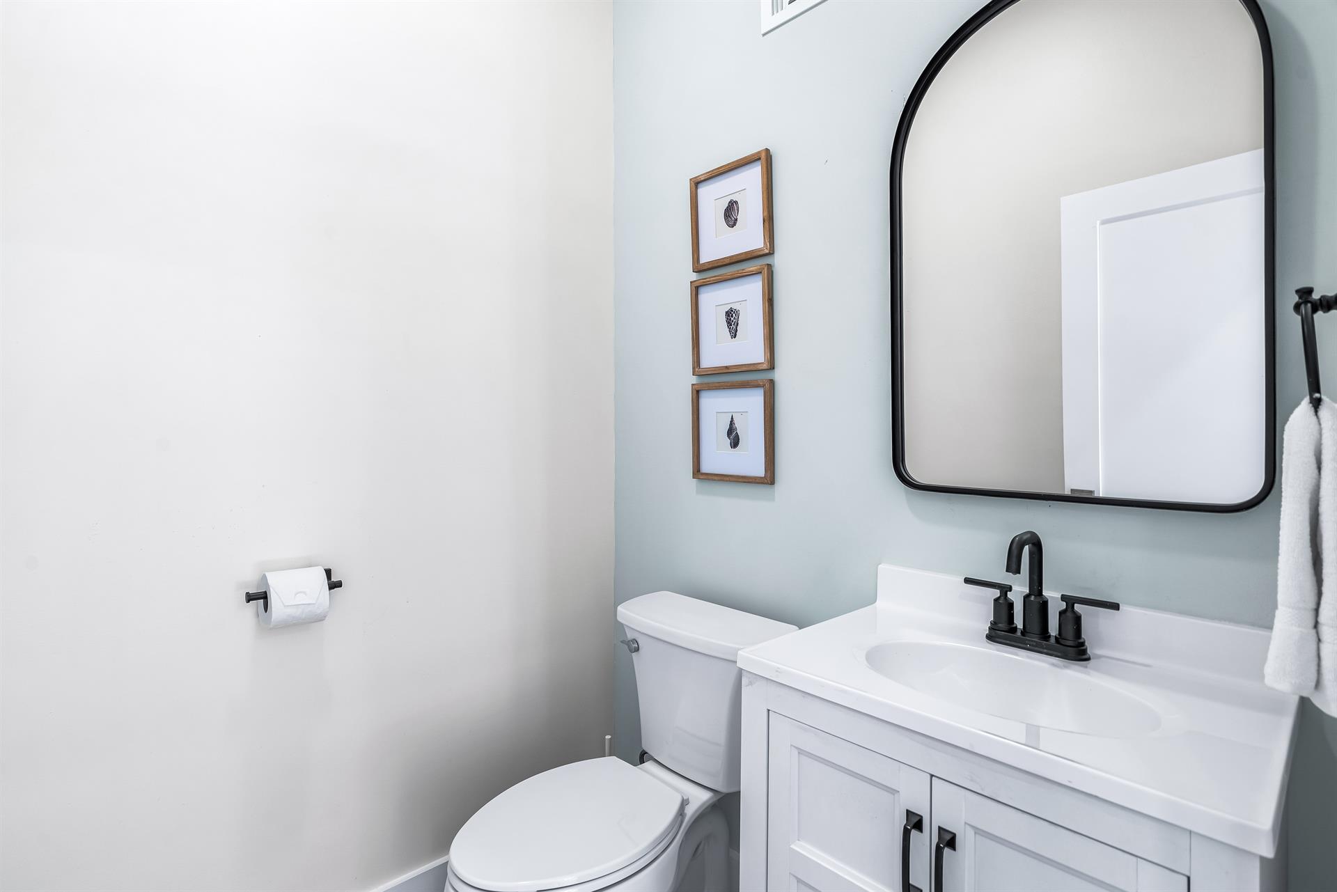 Main Floor Half Bath Located Between the Living and Dining Area