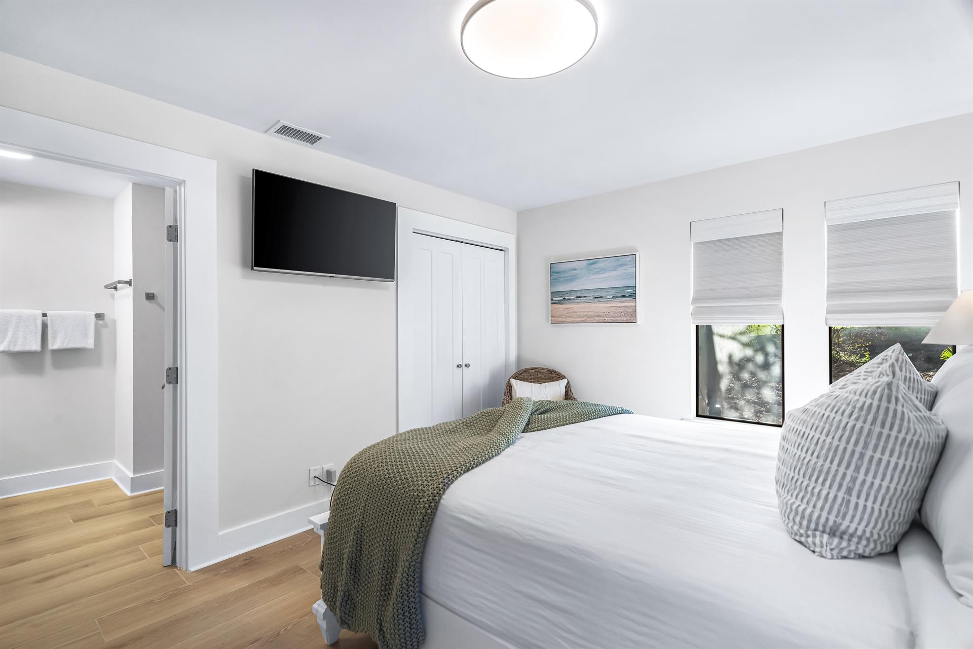 Main Floor Queen Bedroom with Ensuite bath off of The Dining Area with A 42 Smart TV with Cable