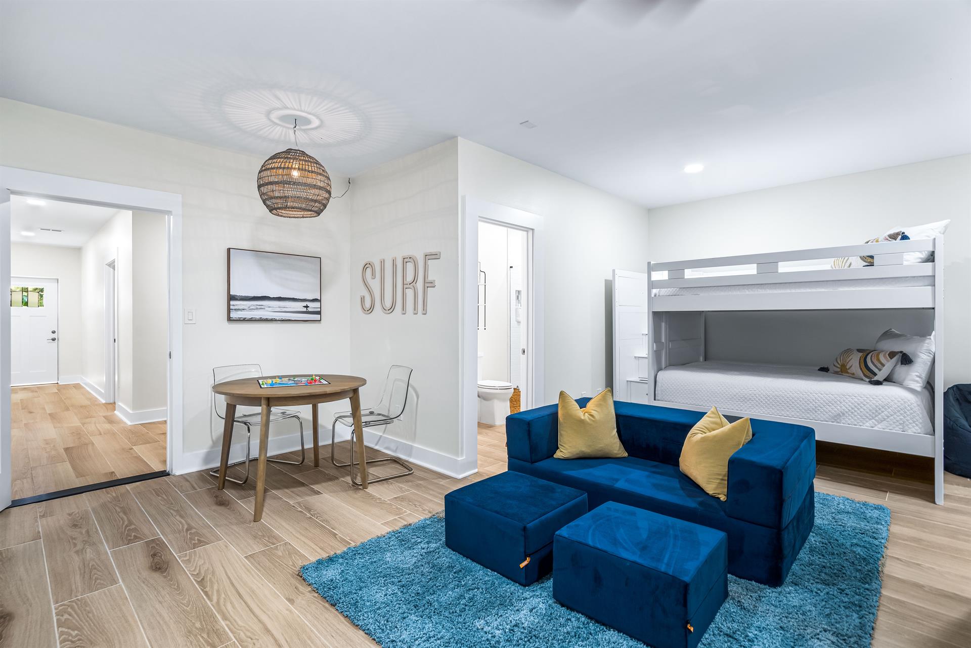 The Kids will really Enjoy This Bunkroom with Seating and Arcade Game and 65 Smart TV Double Bunkroom 4 Full Beds with Ensuite Bathroom