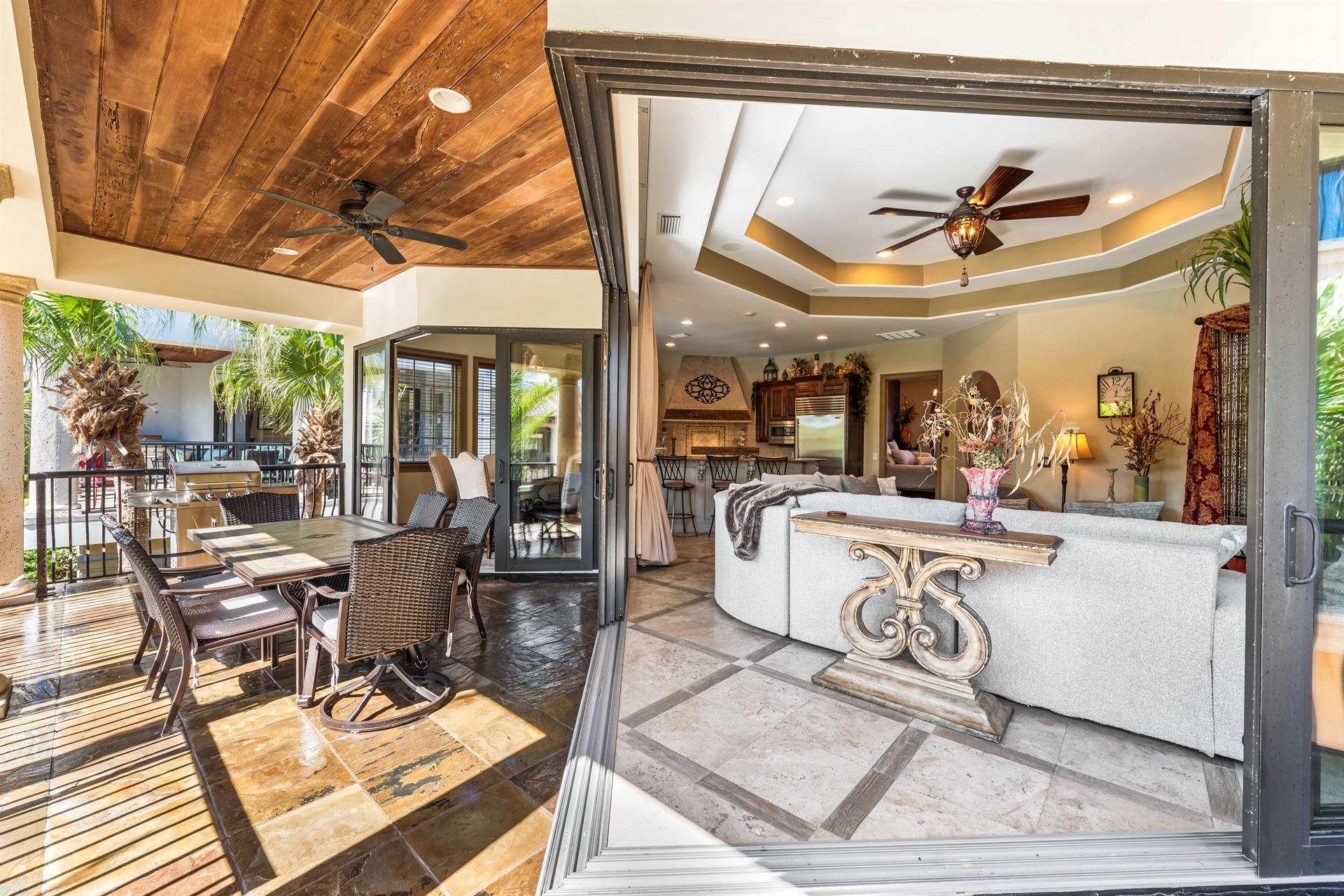 Expansive sliding glass doors that open to create one cohesive gathering space.