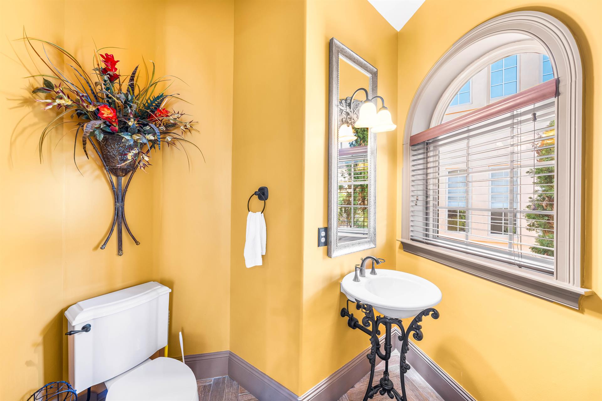 Unique pedestal sink in the powder room.