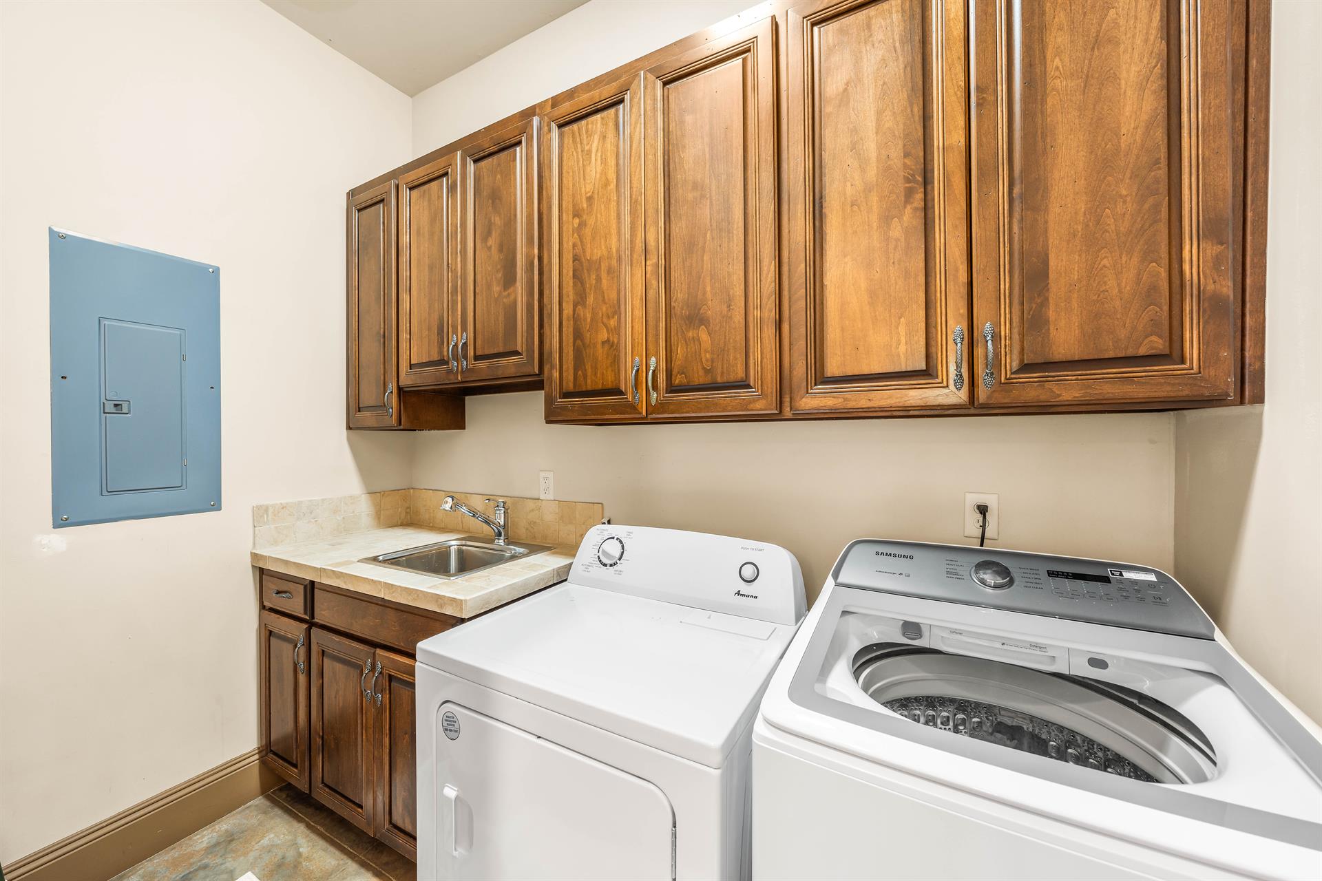Convenient laundry room on the 1st floor with a full size washer  dryer