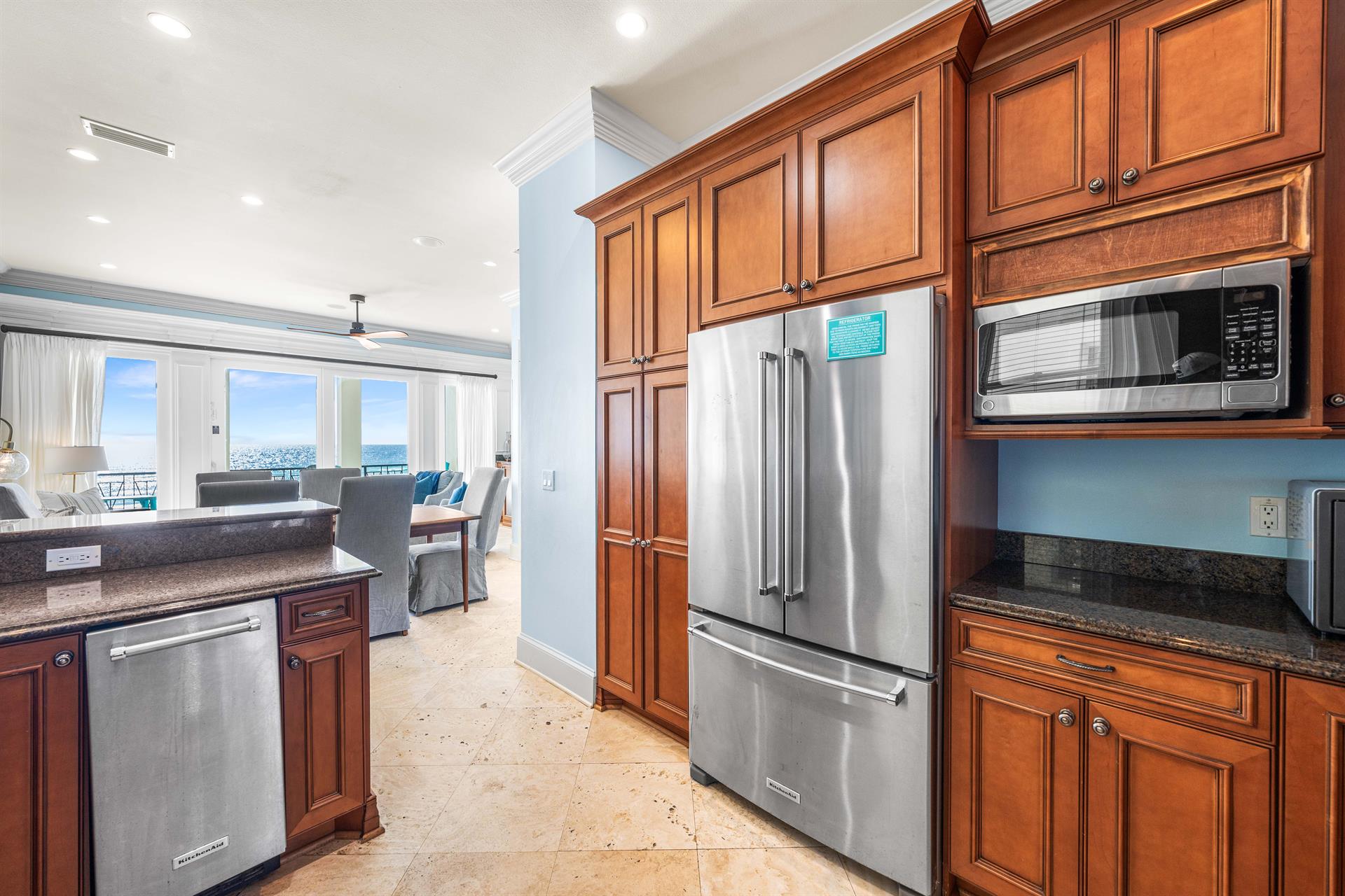 Kitchen with a View Second Floor Fully Stocked  with Granite Countertops, Stainless Steel Appliances including Viking Range, KitchenAid Refrigerator, and UnderCounter Ice Maker.