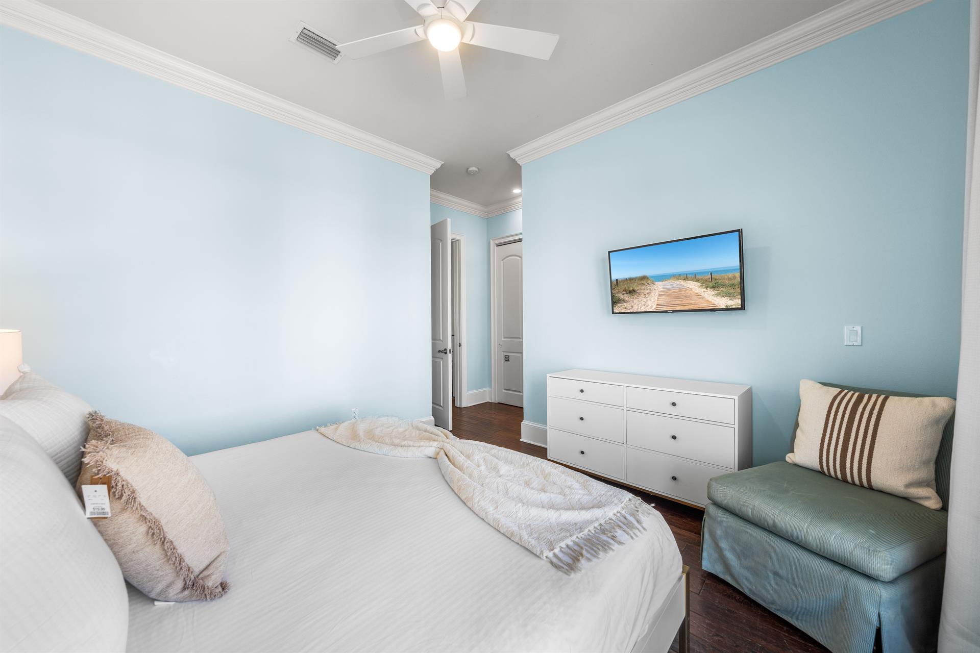 Third Floor Bedroom with King Bed, 40 TV, Ensuite Bathroom with BathtubShower Combination  Balcony Overlooking the Frangista Beach Community.