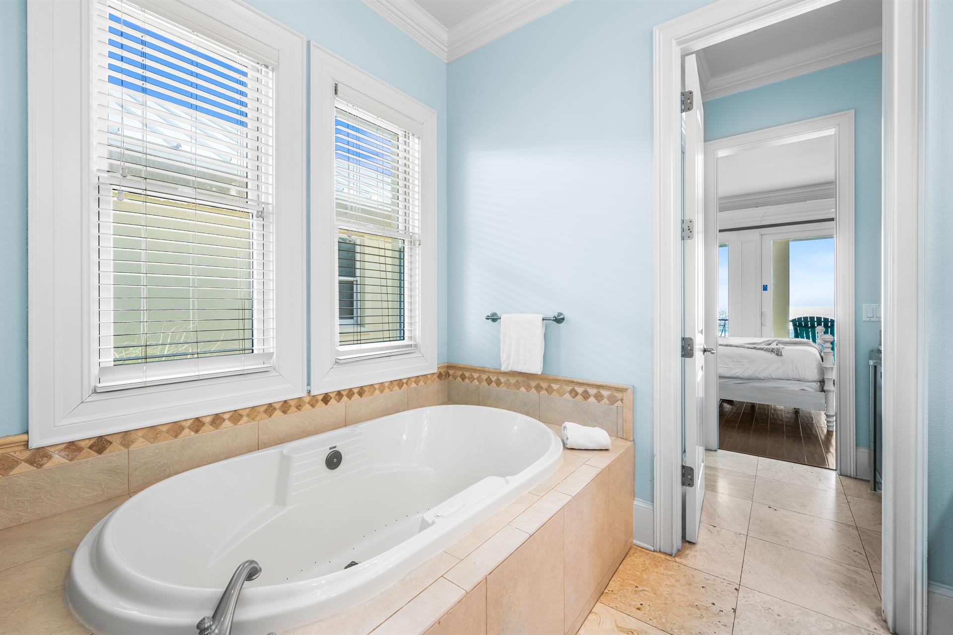 Third Floor Primary Suite Has Large Soaking Bathtub, WalkIn Shower, Double Travertine Vanities,  Water Closet.