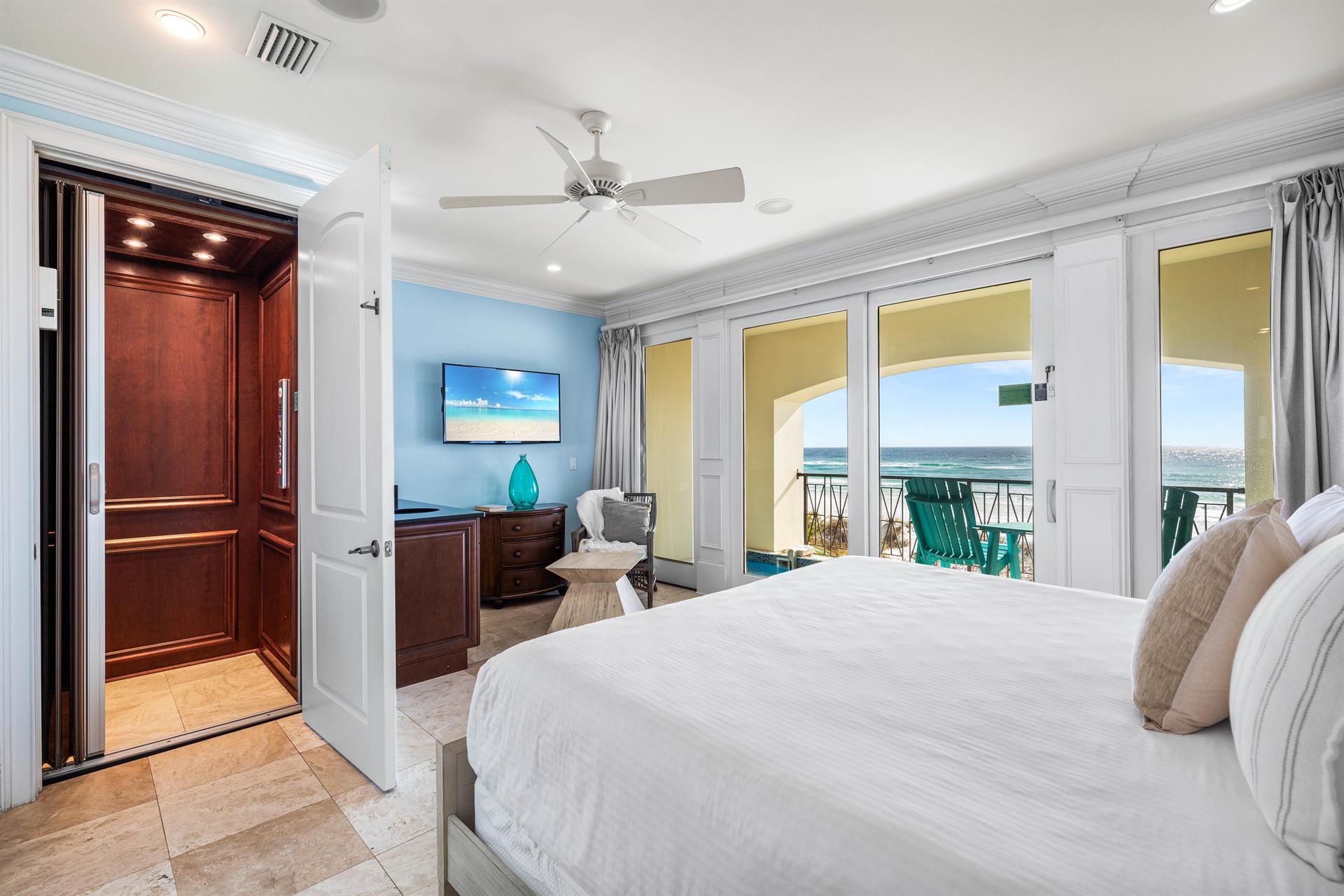 First floor bedroom with king bed, ensuite bath, 50 tv, elevator access with views of the splash pool and Gulf.