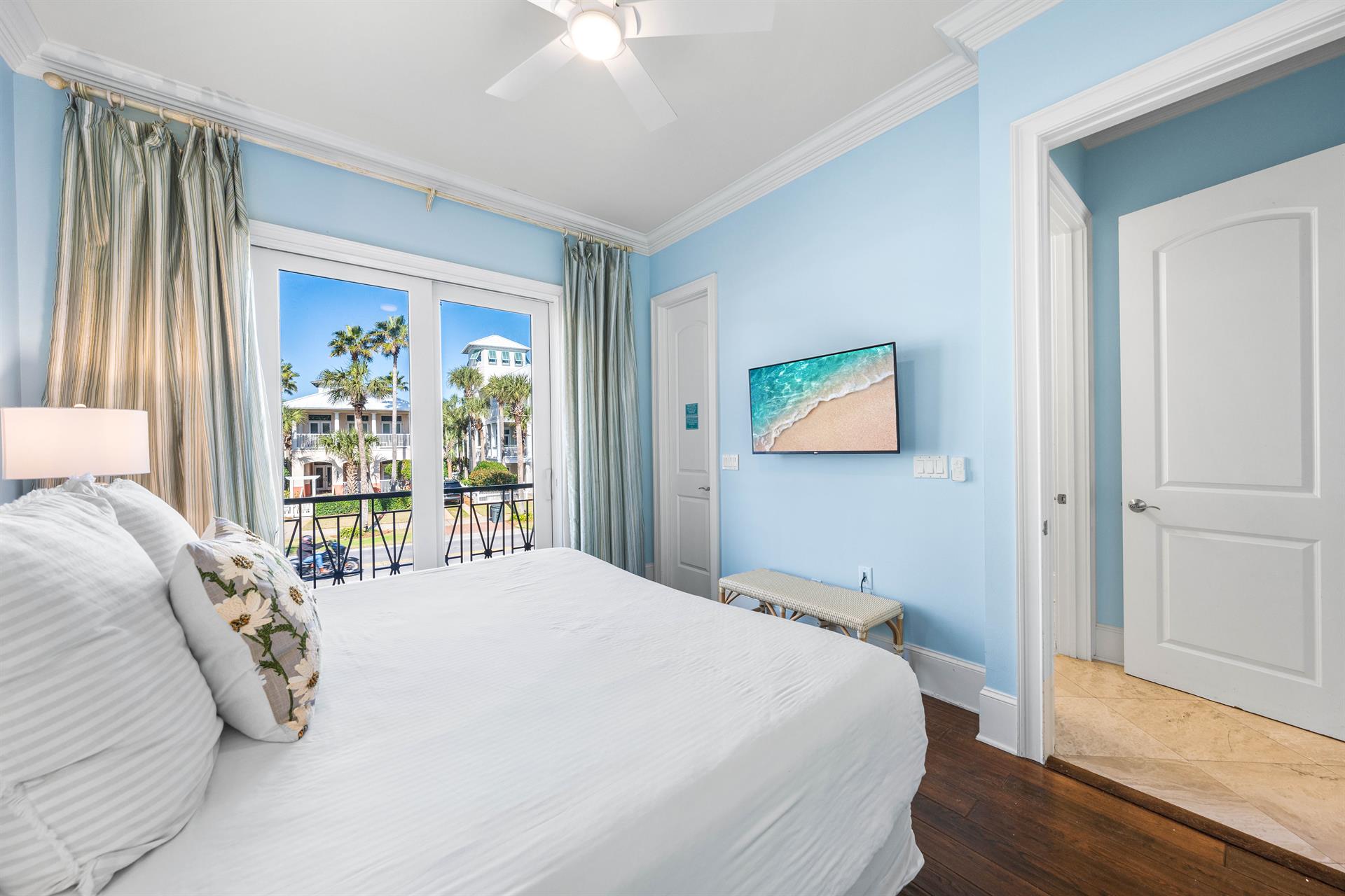 Second Floor Bedroom with king bed, ensuite bathroom, and balcony overlooking the Frangista Beach community.  Walkin closet and 42 tv.