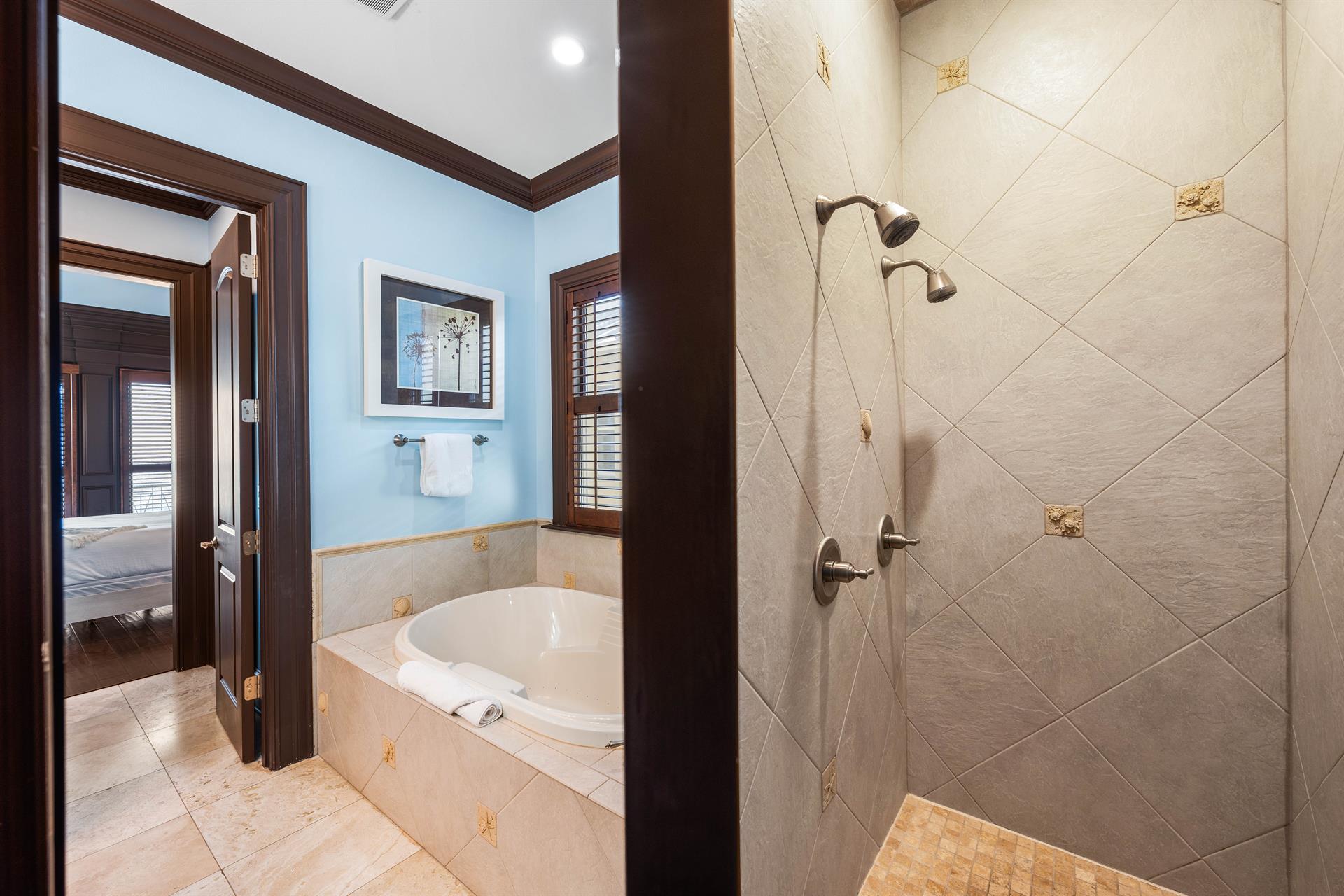 Double Shower Heads in this primary walkin shower