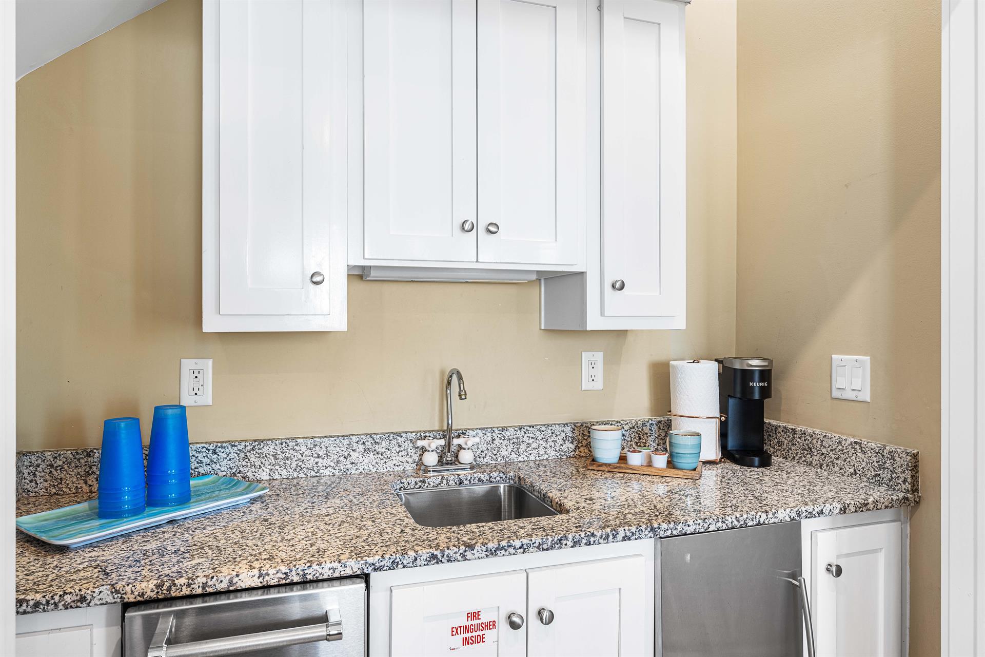 How Convenient  A Wet bar with Keurig, Beverage Cooler, and Ice Maker.