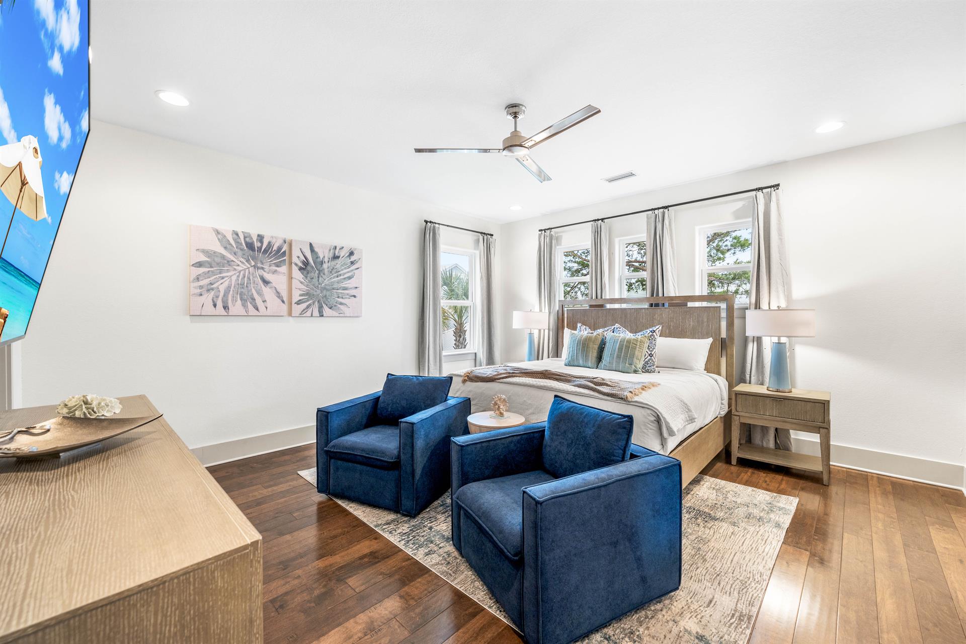 Large primary bedroom with king bed, 42 smart tv, 2 comfy chairs, large walkin closet,  en suite bathroom.