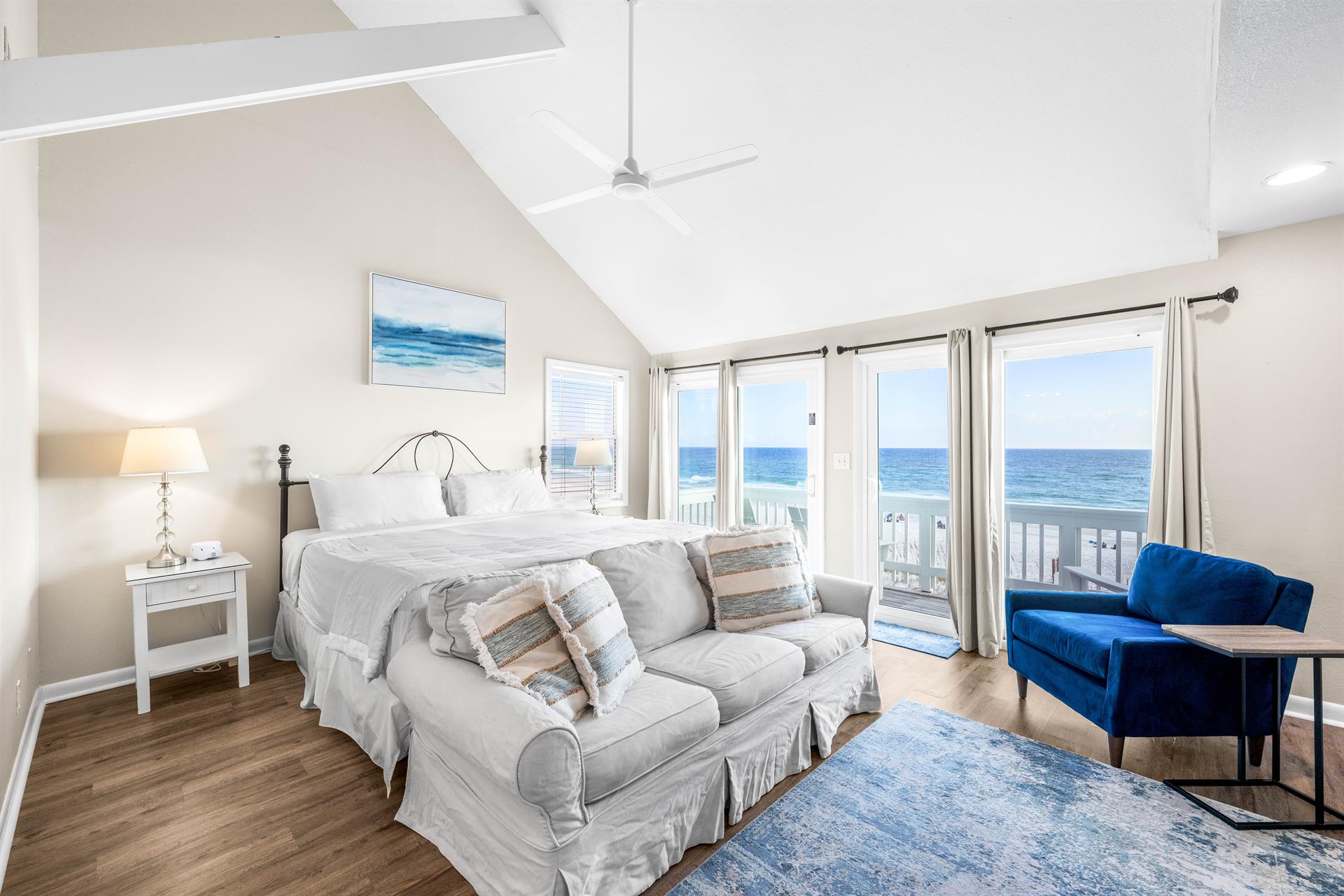 Sleep like royalty—king bed, private balcony, and the soothing sound of ocean waves