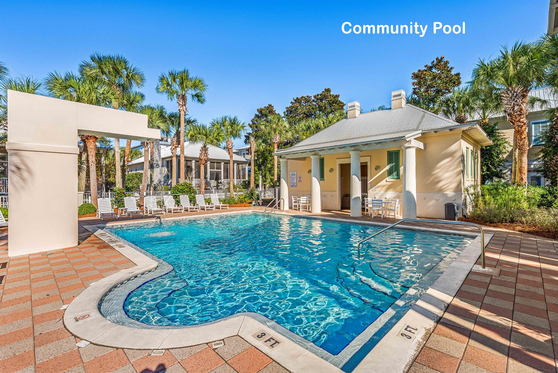 The Gated Community Pool with Waterfall Feature, Chaise Loungers for Sunning, DressingRestrooms,  Outdoor Shower  a minute walk from Toes in the Sand.