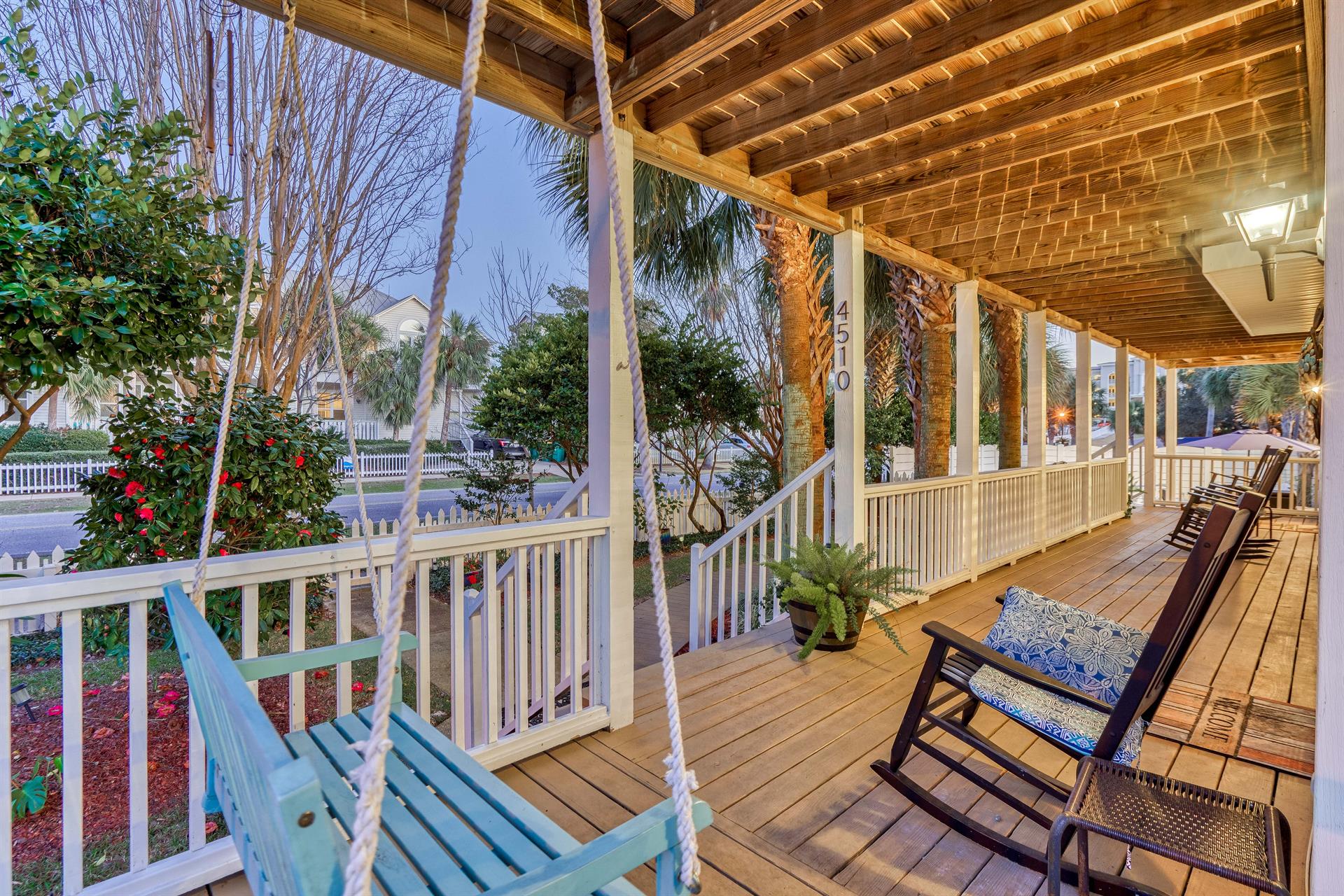Beautiful wraparound porches with plenty of seating and a porch swing make evening especially dreamy
